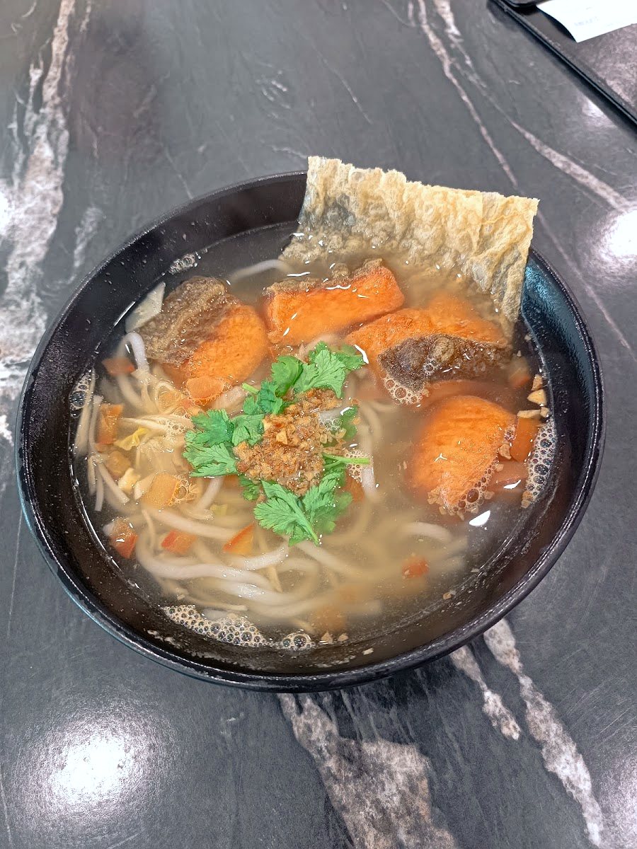 Clear fish noodle soup photograph